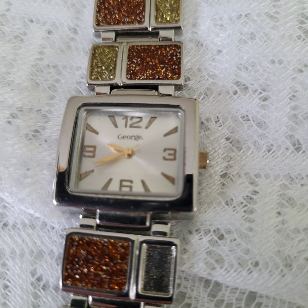 George wrist watch dressy style silver tone with topaz green sparkle band Tested